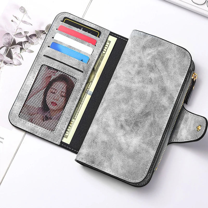 A gray faux leather long zipper handbag coin purse with multiple card slots and a clear window.