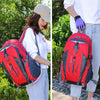 A woman wearing a white shirt and jeans is shown carrying a red and black waterproof hiking backpack outdoors.