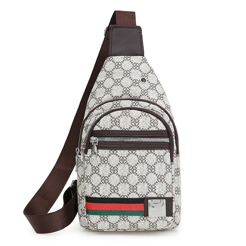 A gray and white patterned printed crossbody sling bag with a brown leather strap and a silver accent.