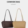 A brown cowhide bag in a dark chocolate color and a beige color shown side by side.