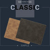 A dark brown leather wallet featuring a simple design and a debossed initial on the cover.