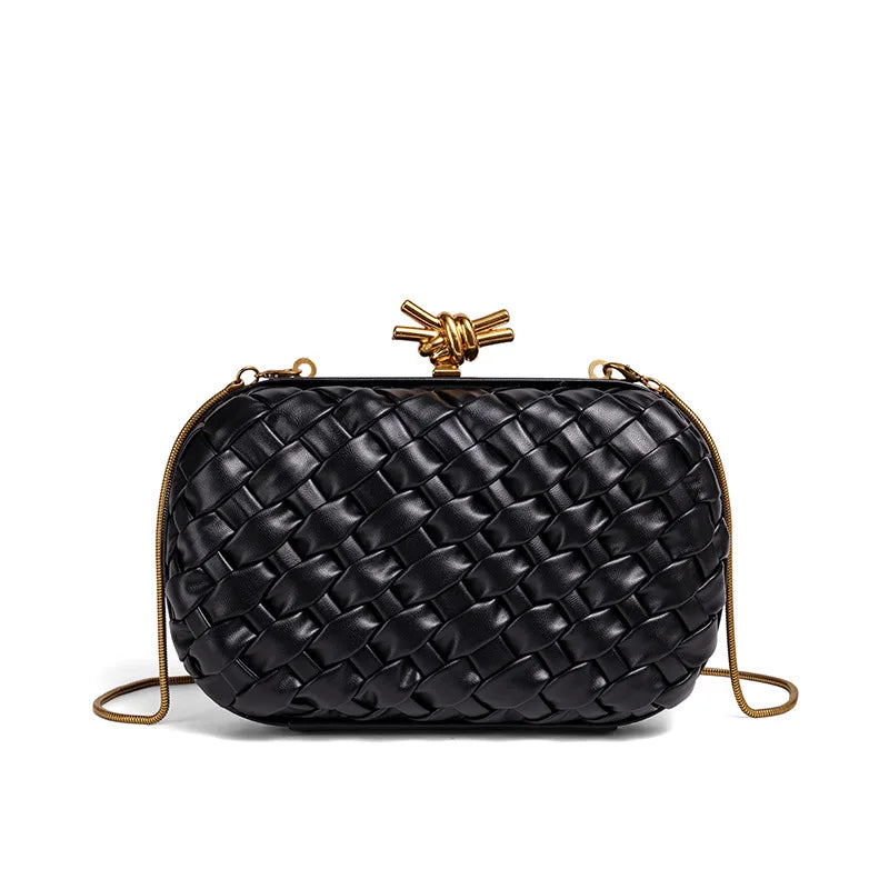 A black handwoven clutch evening bag with a gold-toned clasp and chain detail.