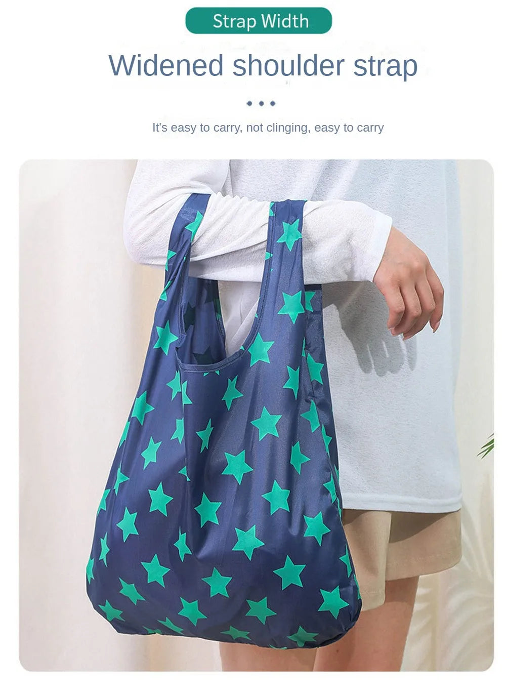 A dark blue reusable shopping bag with a widened shoulder strap is shown being carried by a person.