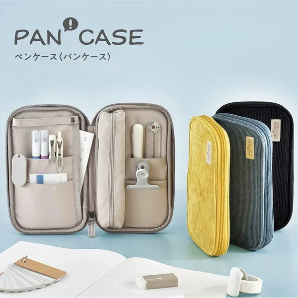 Three tan and gray multi-compartment corduroy pencil cases are displayed on a light blue background.