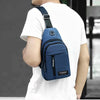 A person is wearing a navy blue casual chest bag with a phone pocket on their white t-shirt.
