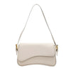 Bolso cruz de cuero beige vintage con correa delgada.