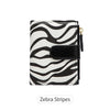 Black and white zebra stripes on a minimalist PU leather bi-fold wallet with an ID window