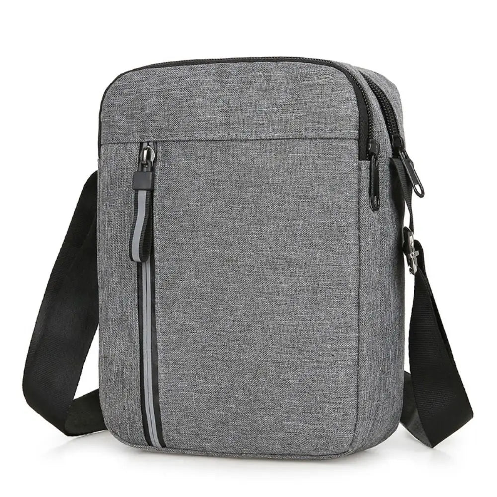 A gray durable waterproof crossbody bag for men shown from the front.