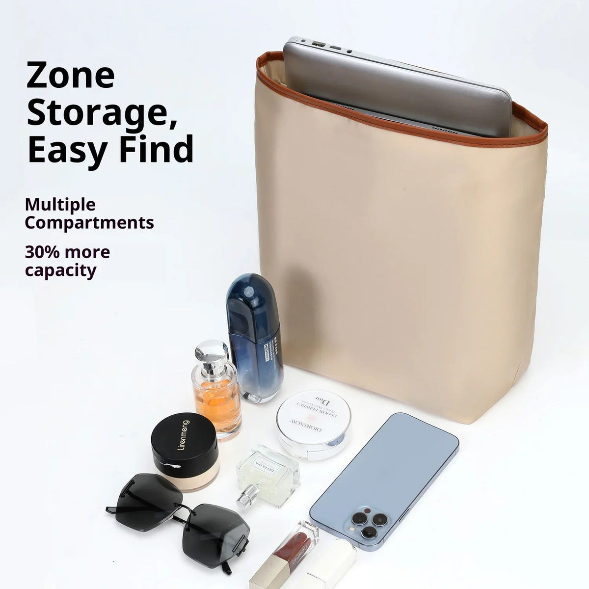 A beige satin bag organizer insert with multiple compartments holds a smartphone, sunglasses, and other small items.