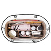 A felt bag organizer insert showing various makeup and grooming tools neatly arranged in a light brown fabric pouch.