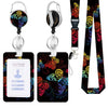A black badge reel with a silver clip and a floral patterned lanyard attached to a neck strap.