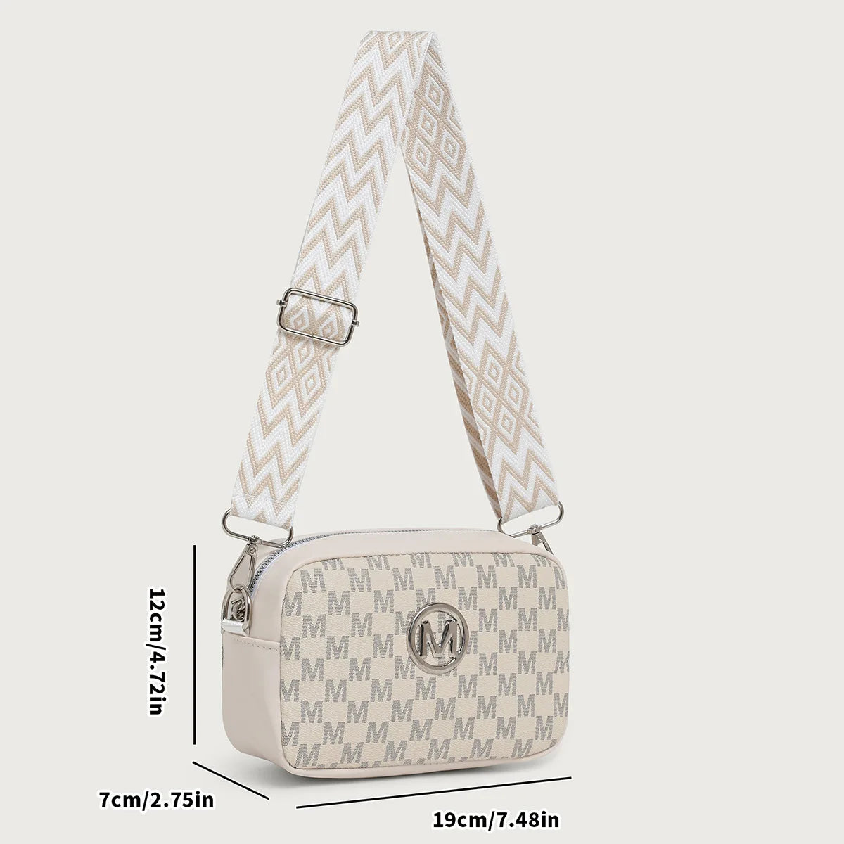 A beige patterned crossbody bag featuring a repeating M-pattern design and a light beige strap.