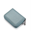 A light blue textured leather card holder wallet with a silver zipper visible on the side.