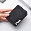A hand holds a black retro PU leather men's wallet with card slots on a white surface.