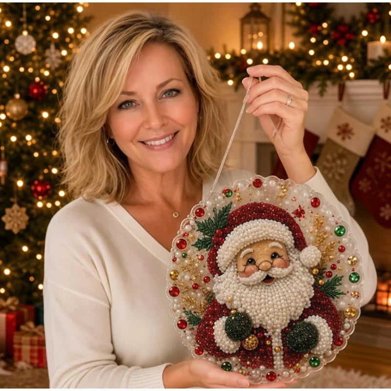 A woman holds a finished pearl diamond painting suncatcher kit with a lace edge in front of a decorated Christmas tree.