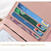 A pink leather card holder wallet displaying various cards and a multi-slot design.
