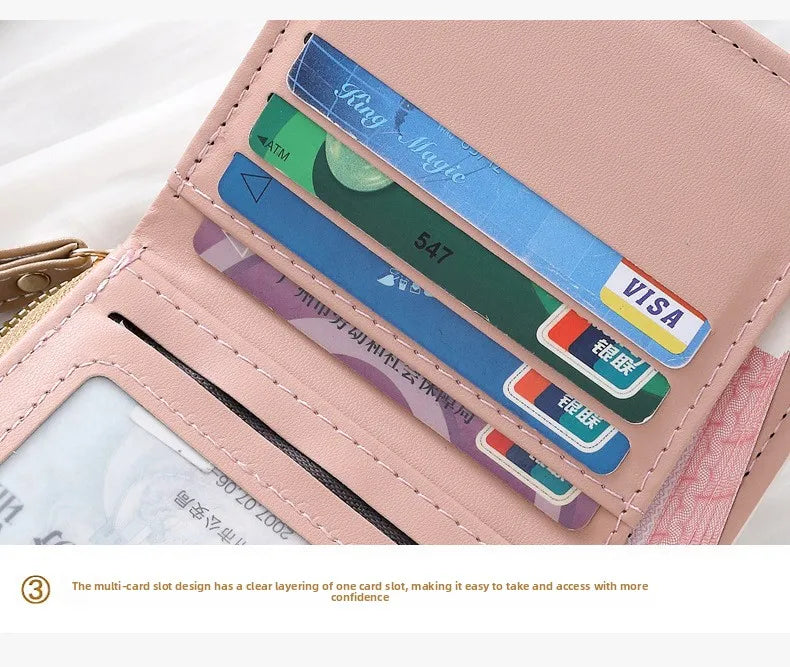 A pink leather card holder wallet displaying various cards and a multi-slot design.