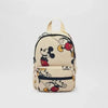 A beige fashion backpack featuring a black and white Mickey Mouse print.