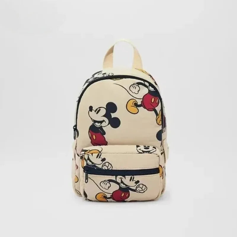 A beige fashion backpack featuring a black and white Mickey Mouse print.