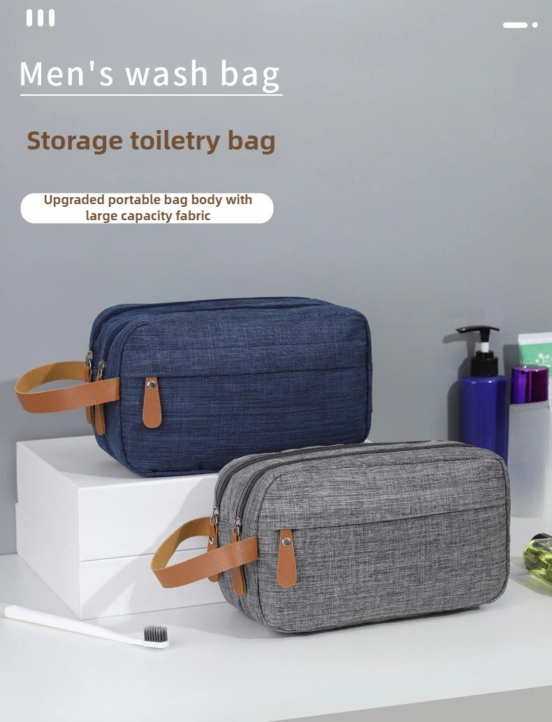 A dark blue and gray portable storage bag for toiletries is displayed on a white surface.