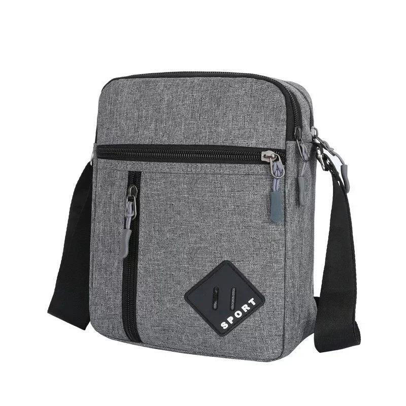 A gray men's lightweight crossbody sling bag with a zippered pocket and black strap.