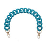 A turquoise acrylic chunky chain shoulder strap for a handbag, shown in a curved shape with metal clasps.