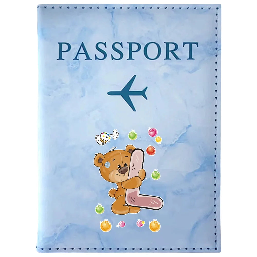 Light blue passport card holder featuring a bear illustration and a stylized airplane.