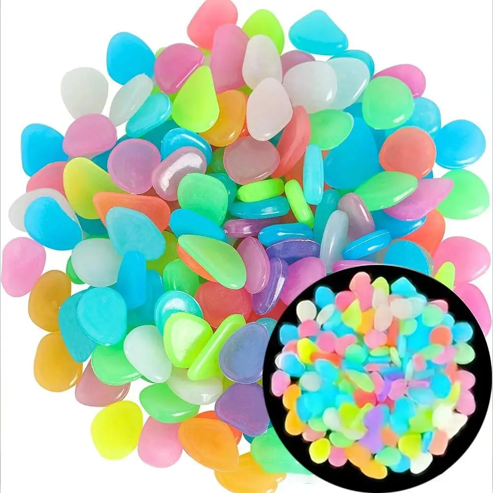 A pile of glow-in-the-dark solar pebbles in various shades of blue, green, pink, and yellow.