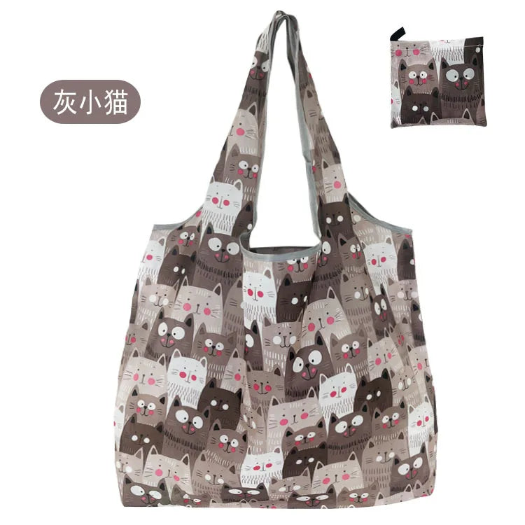 A reusable fashion shopping tote bag featuring a pattern of cute cats in shades of gray and brown.