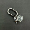 Silver keychain featuring a clear resin die with the number 20 and a star charm