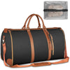A dark gray duffle bag with brown leather accents and a clear plastic storage pouch.