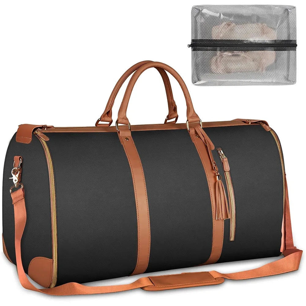 A dark gray duffle bag with brown leather accents and a clear plastic storage pouch.