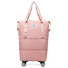 Pochette de voyage rose et extensible multi-usage avec poignées et roues.