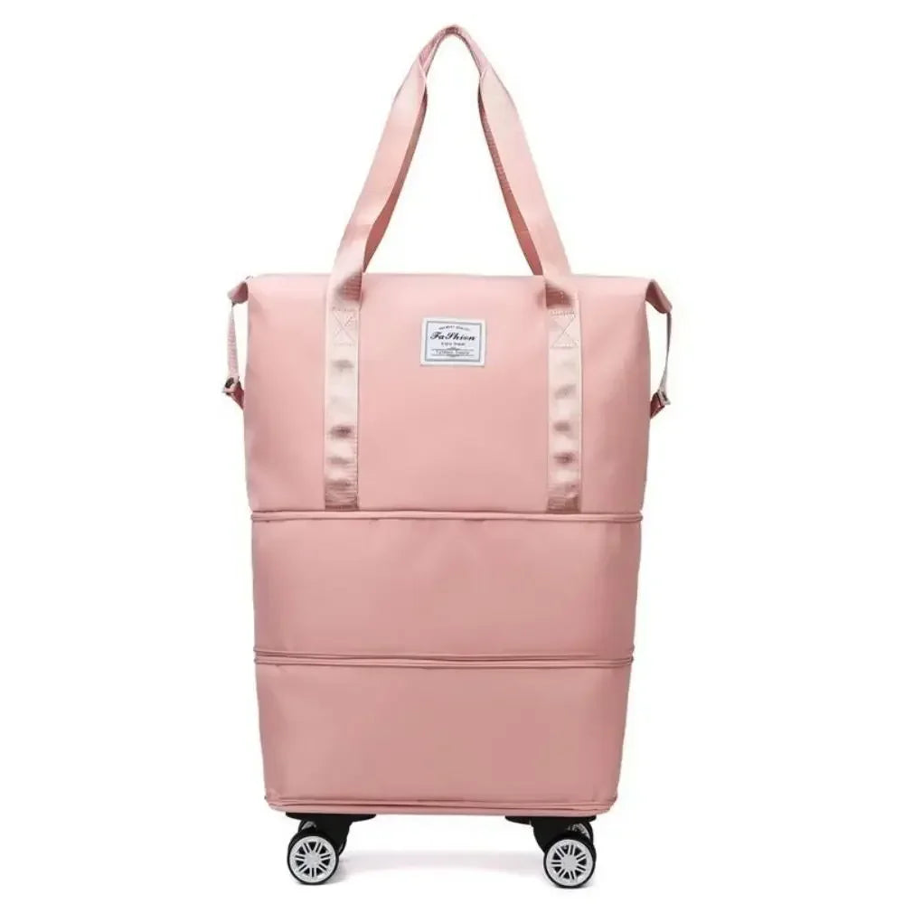 Pochette de voyage rose et extensible multi-usage avec poignées et roues.