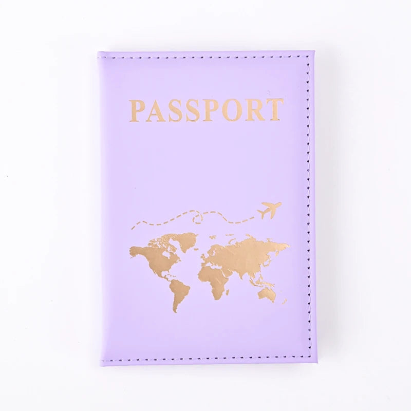 A purple PU leather passport holder wallet with gold foil printing of a world map.