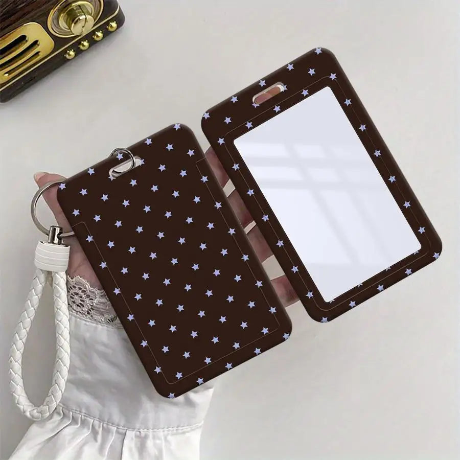 A dark brown card holder with a grid design and a white insert is being held by a hand, featuring a white cord lanyard.