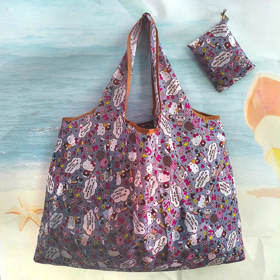 A purple and pink patterned reusable shopping bag is displayed against a light blue background with water and a starfish.