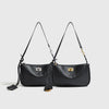 A black classic split leather shoulder tote bag with gold hardware displayed against a light gray background.