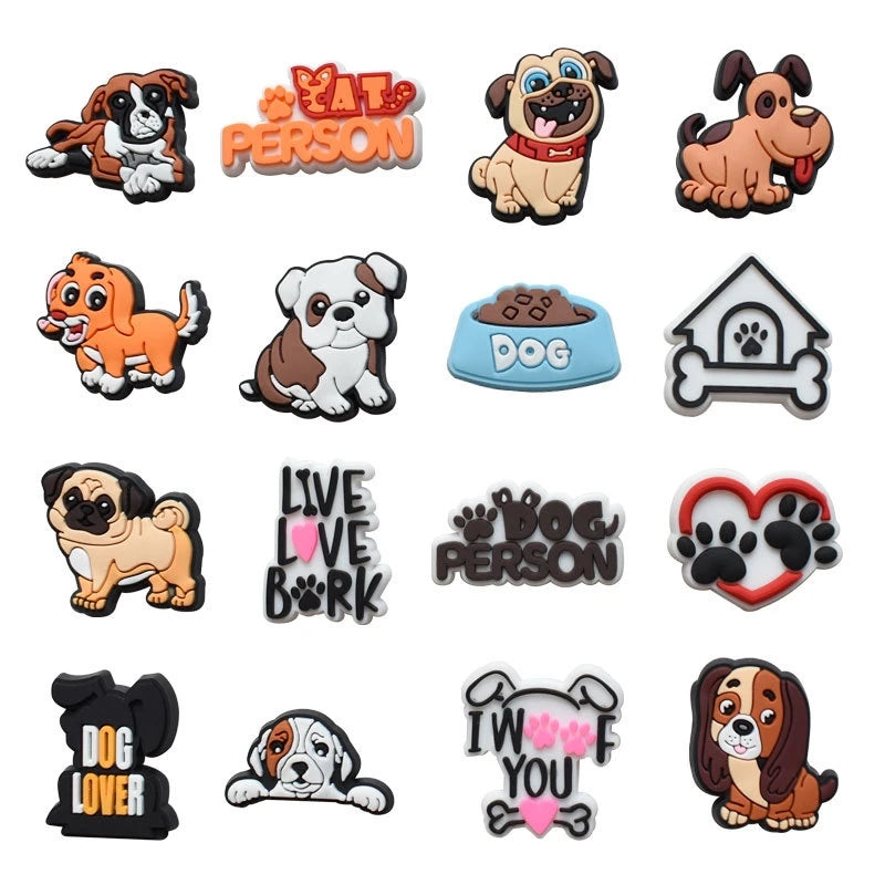 A collection of decorative shoe charms and pins featuring various dog breeds, silhouettes, and text like Dog Person and Dog L
