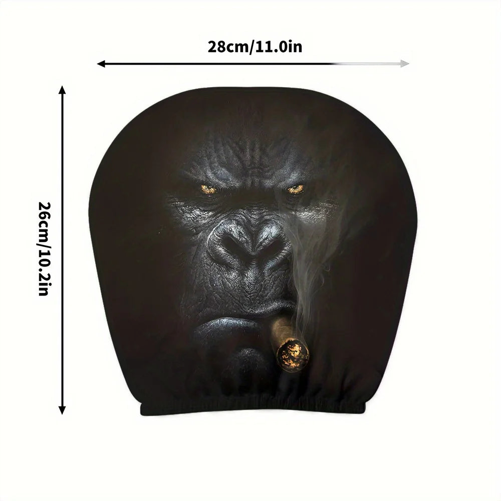 A dark silicone car headrest cover shaped like a gorilla face, shown from the front.