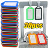 A set of 30 customizable luggage tags in various colors, including green, black, and orange, displayed on a metal rack.