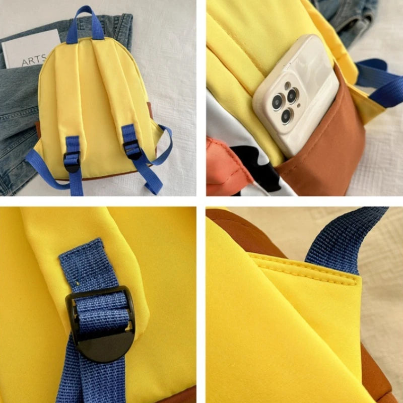 A yellow fashion backpack with blue accents and a brown leather strap is shown alongside a smartphone.