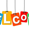 Colorful paper tags spelling out WELCOME hanging from strings