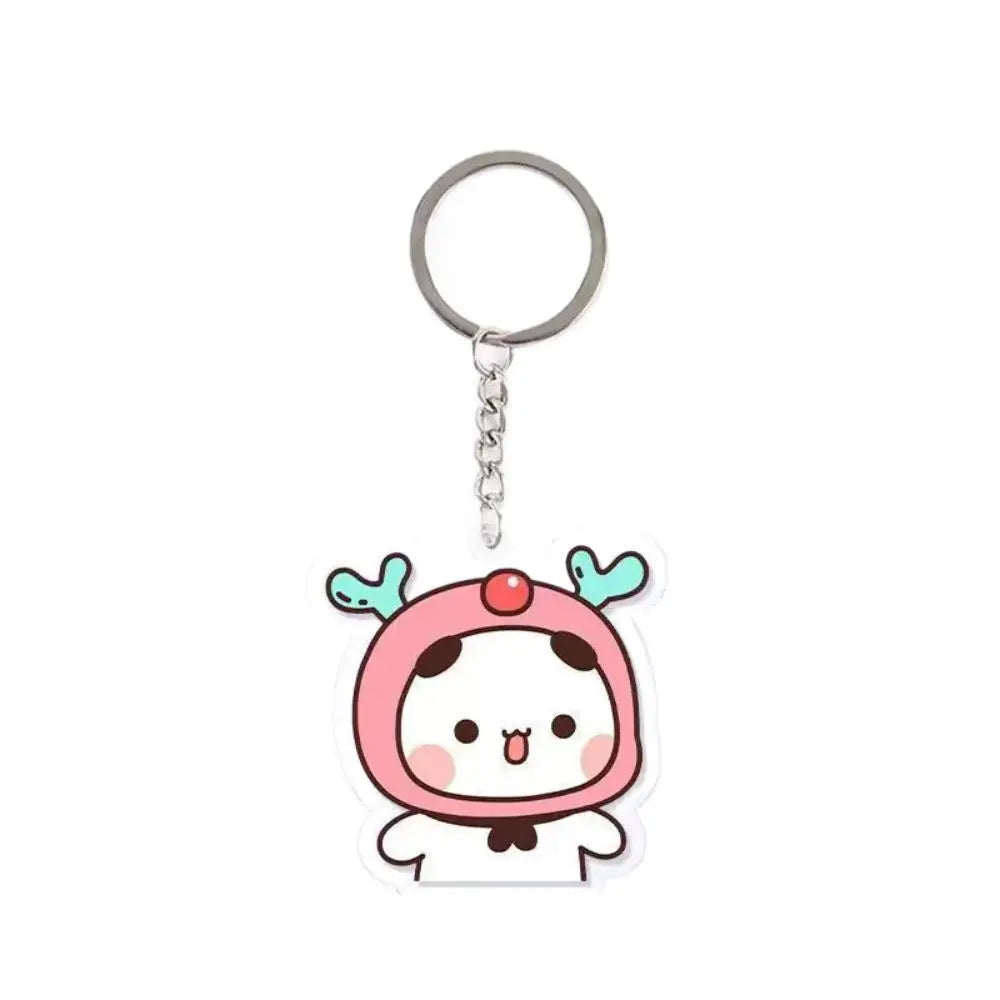 A pink and white cartoon character keychain charm with a silver ring.
