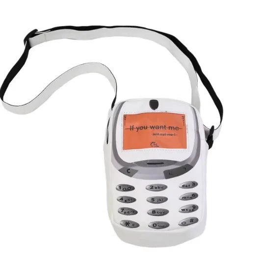 A white vintage Y2K telephone backpack with a coiled cord and keypad visible.