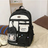 A black and white Candy Color Campus backpack for women with a beige lining and decorative details.