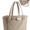 A beige premium women's laptop tote bag with padded straps and a separate pouch shown next to the main bag.
