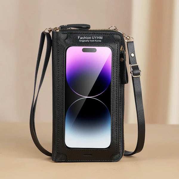 A black fashion phone bag with a clear display and gold hardware is shown against a light background.