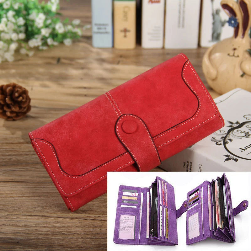 A red PU leather clutch wallet with a stitched design is shown next to an open purple wallet displaying various cards.