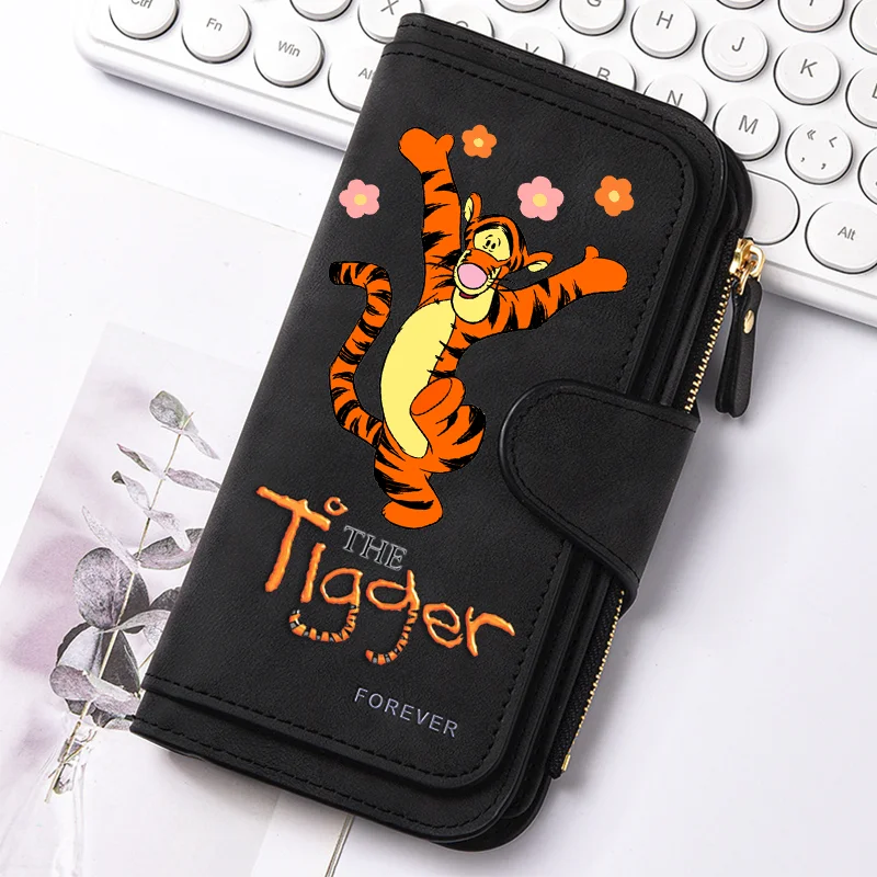 A black zippered pouch featuring an orange tiger design and the text The Tiger Forever resting on a white background.